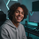 Portrait of a smiling young person, representing a happy customer, in a minimalist gamer room with RGB lighting.